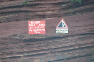 Safety signs point out dangerous cliff faces (also look out for cliffs covered by plants)