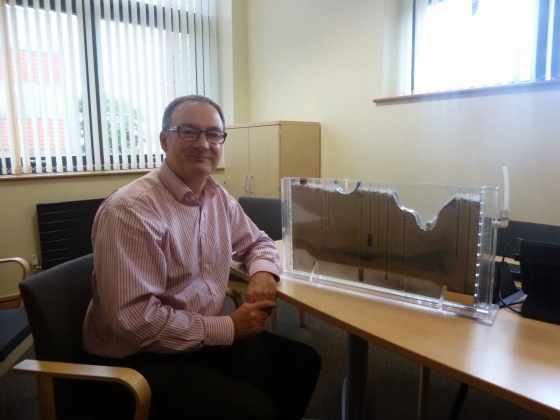 Dr Rob Ward with the amazing sand tank model he and his team use in outreach events!