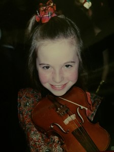 My short lived career as a violinist - note the snazzy waistcoat and scrunchie!