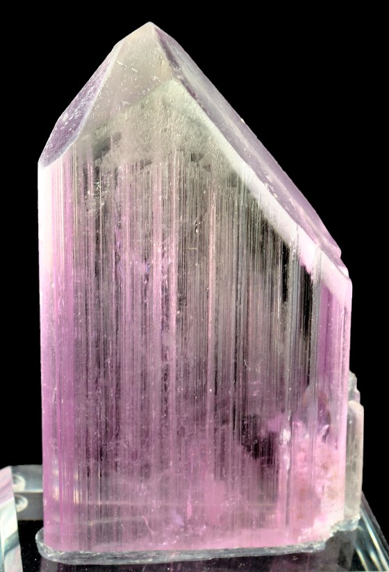 This is a lovely pinkish coloured crystal of Spodumene and if gem quality, could be called Kunzite as well. Image is from Wikipedia.